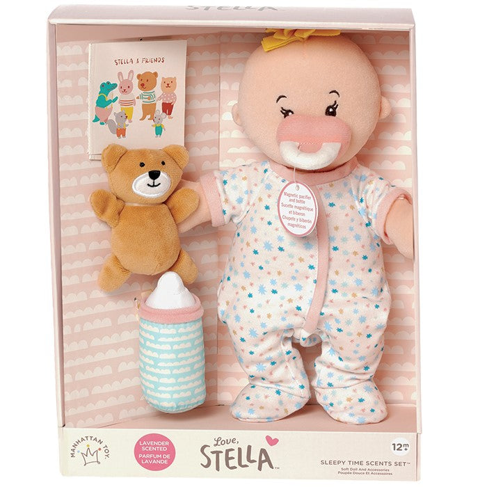 soft baby doll with peach skin tone that is lavender scented and comes with a soft bear mini book and soft bottle for pretend play pictured in open front box package