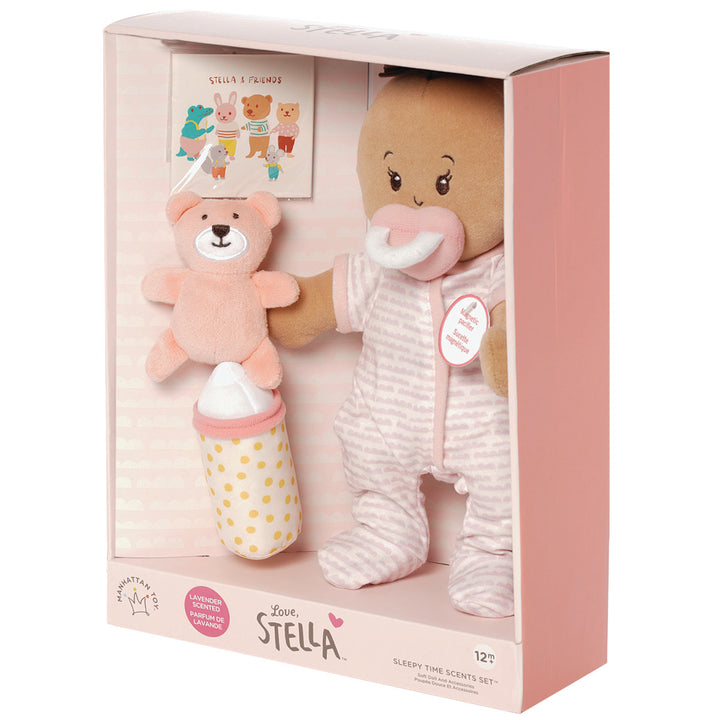 soft baby doll with beige skin tone that is lavender scented and comes with a soft bear mini book and soft bottle for pretend play pictured in open front box package