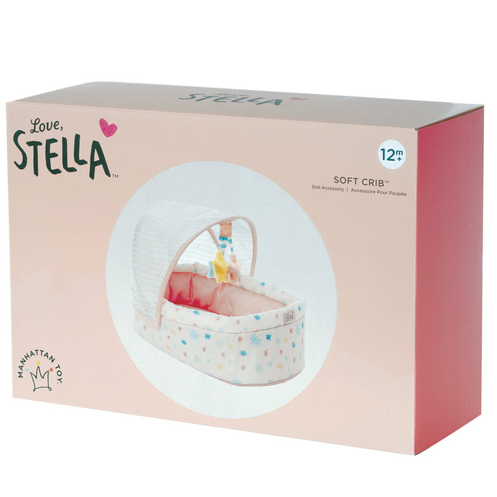 soft baby doll crib with removable hanging mobile and canopy pictured in box retail packaging