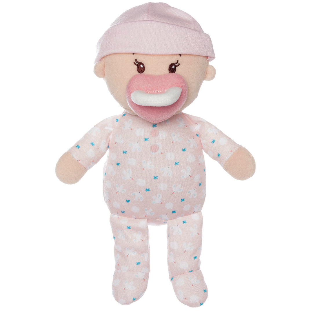 soft baby snuggle doll with peach skin that includes a magnetic pacifier and removable pink beanie hat