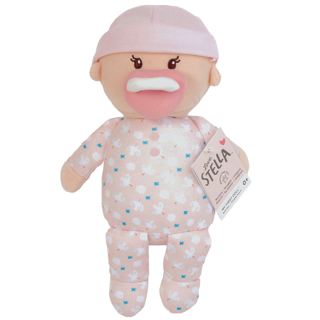 soft baby snuggle doll with peach skin that includes a magnetic pacifier and removable pink beanie hat with hang tag packaging