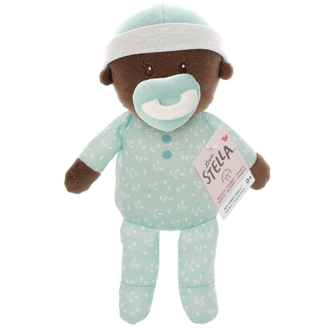 soft baby snuggle doll with brown skin with magnetic pacifier pictured with hang tag packaging