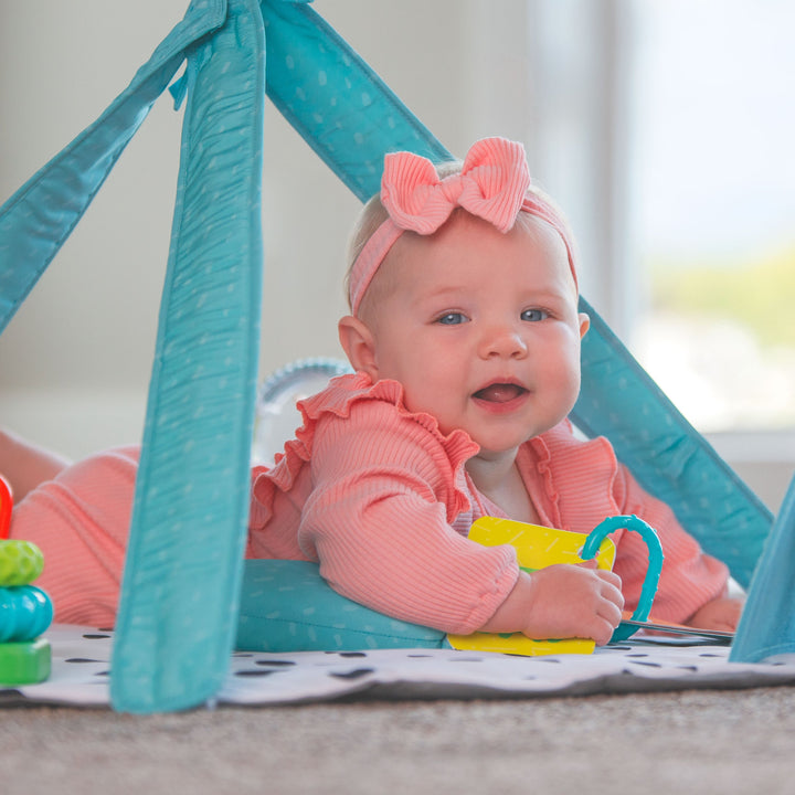 colorful playmat with baby on tummy