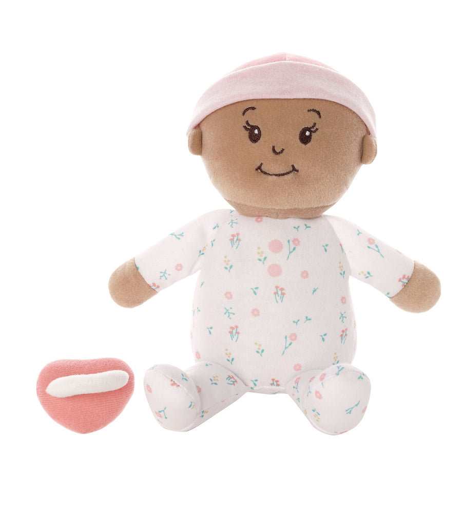 soft baby snuggle doll with beige skin that includes a magnetic pacifier 