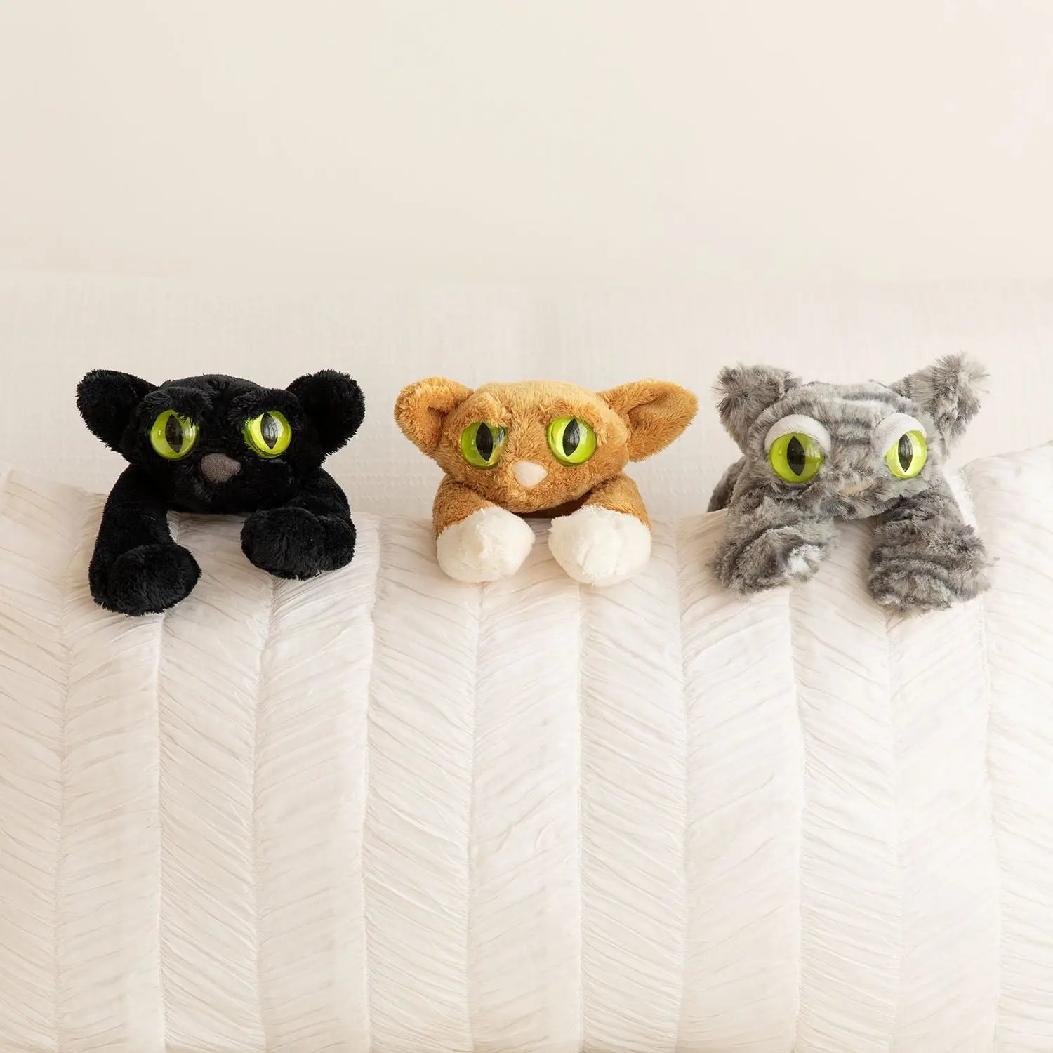 Cats and stuffed store animals